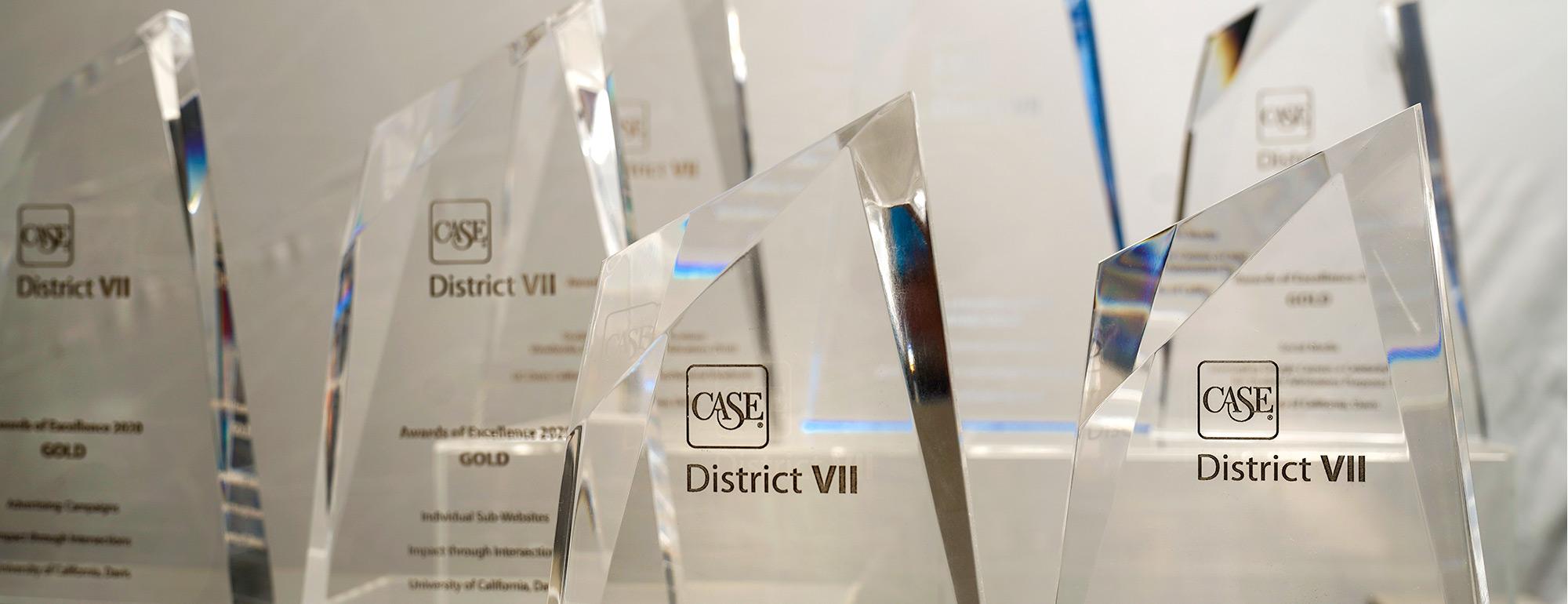 close up of CASE awards that strategic communications won for various projects