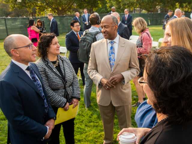 CEO of UC Davis Health and VIce Chancellor of Human Health Sciences, Davis Lubarsky, Chief Marketing and Communications officer Dana Topousis, and UC Davis Chancellor Gary May talking outside