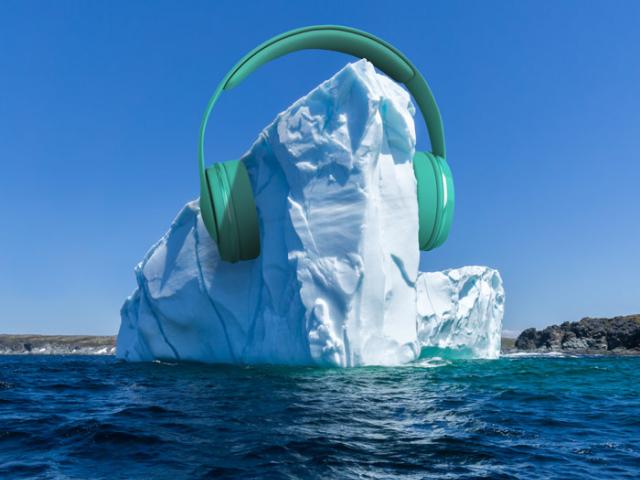 iceberg in the ocean wearing giant headphones